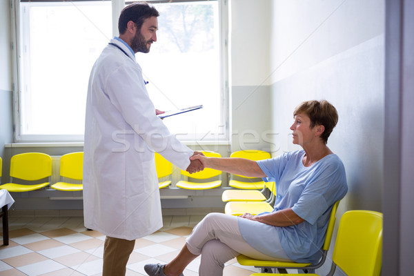 Doctor shaking hand with patient in waiting room Stock photo © wavebreak_media