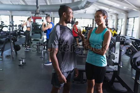 Young friends doing chin-ups in gym Stock photo © wavebreak_media