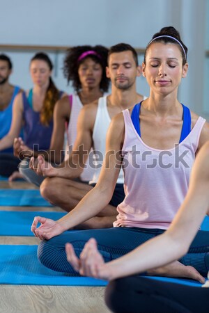 Stock photo: Group of people performing yoga