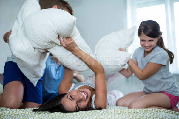 Family having pillow fight in bedroom Stock photo © wavebreak_media