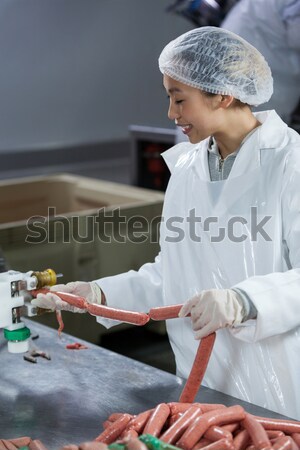 Butcher emptying tray with minced meat Stock photo © wavebreak_media