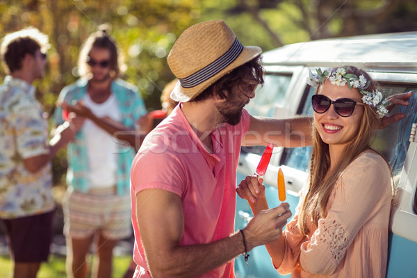 Couple enjoying and eating ice lolly Stock photo © wavebreak_media