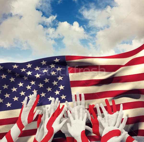 Composite image of people raising hands in the air Stock photo © wavebreak_media