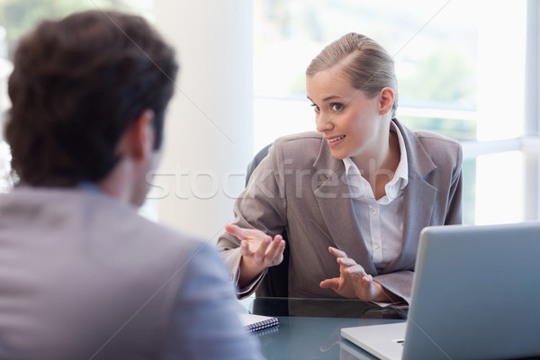 Cute businesswoman receiving a customer in her office Stock photo © wavebreak_media