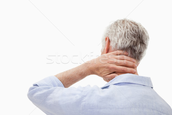 Man having a neck pain against a white background Stock photo © wavebreak_media