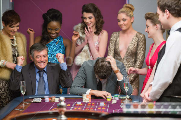 One man winning and one man losing at roulette table in casino Stock photo © wavebreak_media