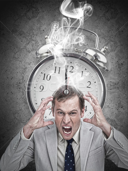 Stressed businessman with a hot deadline Stock photo © wavebreak_media