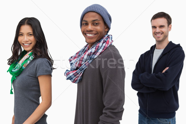Smiling stylish young people in a row  Stock photo © wavebreak_media