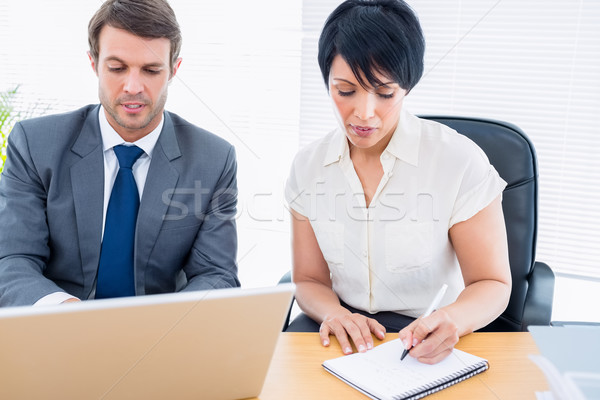 Colegas reunião de negócios moço mulher mesa de escritório computador Foto stock © wavebreak_media