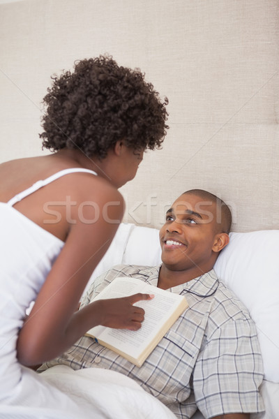 Happy couple in bed together Stock photo © wavebreak_media