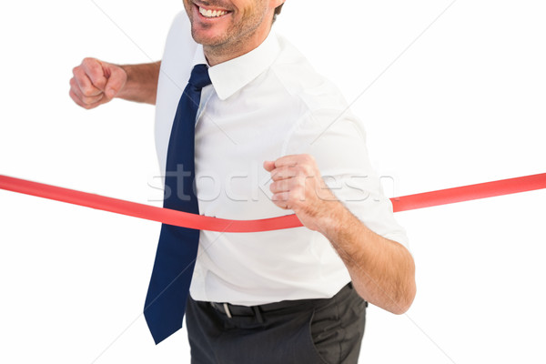 Businessman smiling and crossing the line Stock photo © wavebreak_media