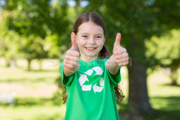 Happy little girl in green with thumbs up  Stock photo © wavebreak_media