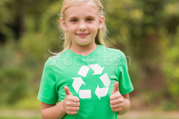 Happy little girl in green with thumbs up  Stock photo © wavebreak_media