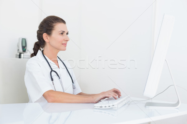 Concentrating doctor using computer  Stock photo © wavebreak_media