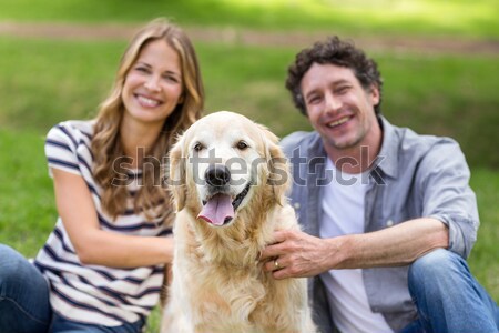 Happy couple with their pet dog  Stock photo © wavebreak_media