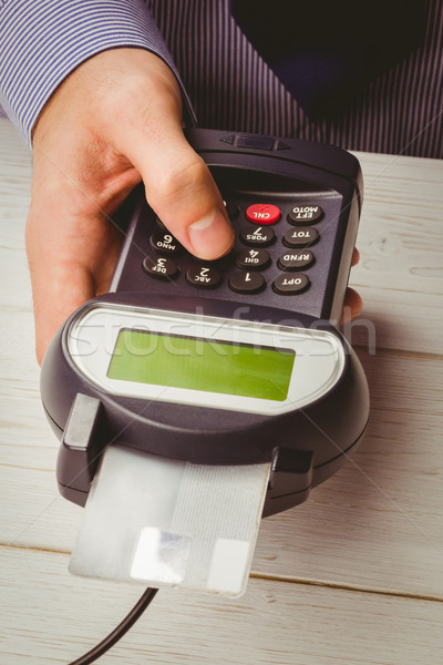 Man entering his pin on terminal Stock photo © wavebreak_media