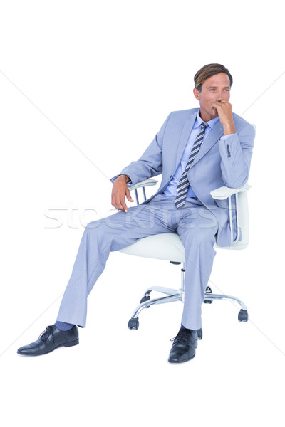  Handsome businessman sitting on a swivel chair Stock photo © wavebreak_media