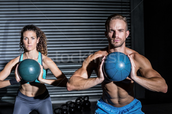 Muscular couple doing ball exercise Stock photo © wavebreak_media
