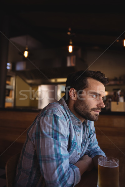 Thoughtful man having beer Stock photo © wavebreak_media