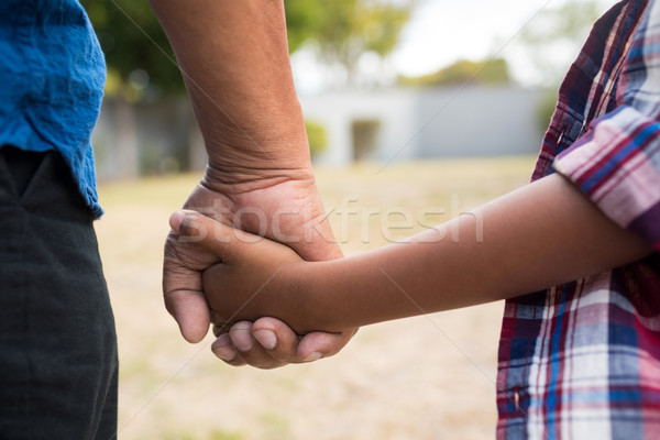 Immagine ragazzo nonno holding hands piedi mani Foto d'archivio © wavebreak_media