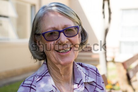 Cute little girl smiling at camera on a sunny day Stock photo © wavebreak_media