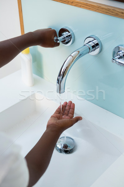 High angle view of boy washing hands in wash bowl Stock photo © wavebreak_media