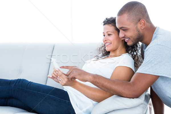 Szczęśliwy para patrząc relaks sofa domu Zdjęcia stock © wavebreak_media