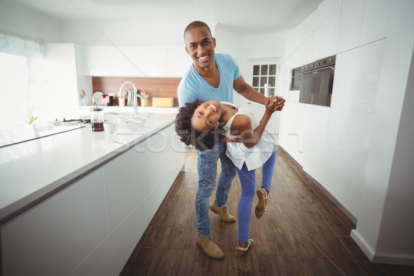 Happy couple dancing in the kitchen Stock photo © wavebreak_media