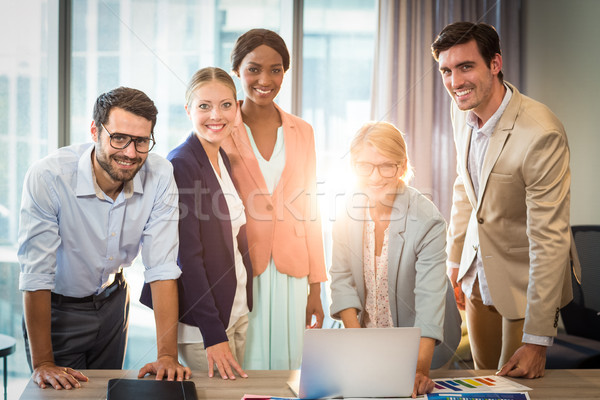 Group of business people interacting using laptop Stock photo © wavebreak_media