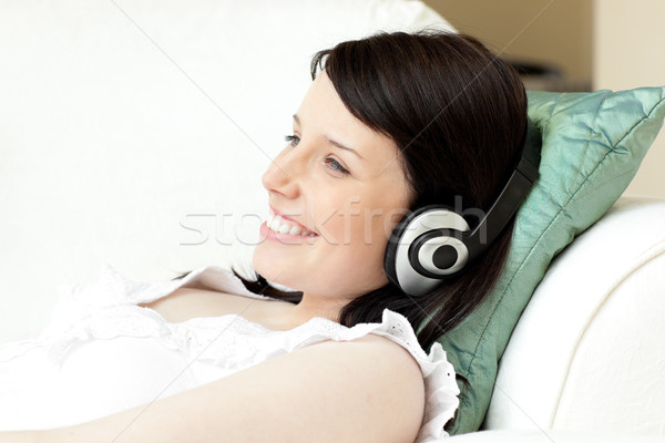 [[stock_photo]]: Charmant · jeune · femme · écouter · musique · casque · téléphone