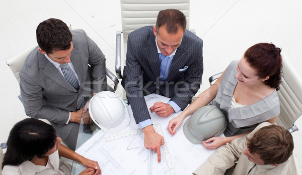 High angle of young architects working with plans Stock photo © wavebreak_media