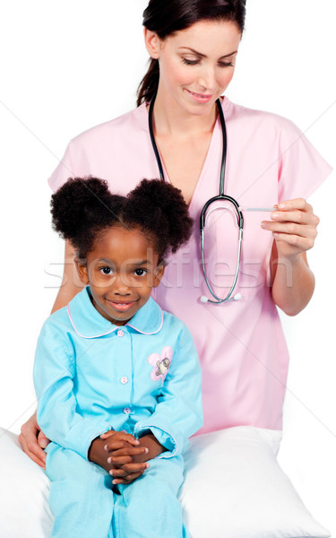 Female nurse taking little girl's temperature  Stock photo © wavebreak_media