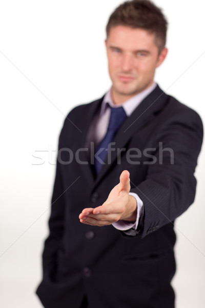 businessman showing a handshake to the camera Stock photo © wavebreak_media