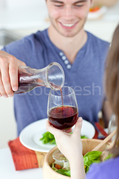 Jeune homme manger femme maison vin homme [[stock_photo]] © wavebreak_media