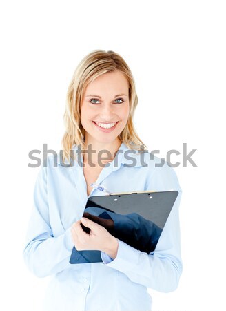 Assertive businesswoman taking notes on a clipboard against a white background Stock photo © wavebreak_media