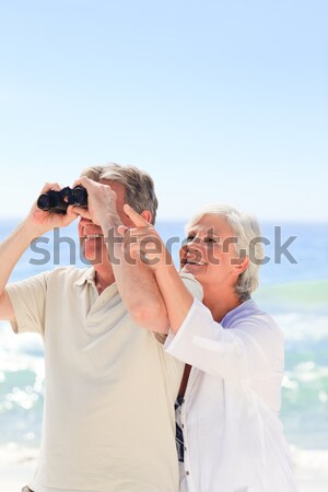 Couple looking at the sky with their binoculars Stock photo © wavebreak_media