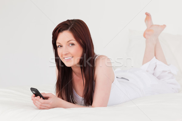 Vonzó női ír szöveg mobil ágy Stock fotó © wavebreak_media