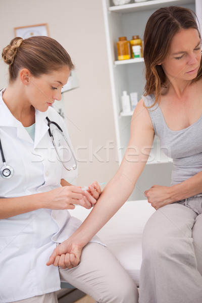 Stock photo: Patient getting immunization from doctor