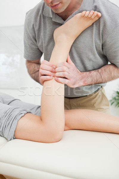 Close-up of a man massaging the leg of a woman in a room Stock photo © wavebreak_media