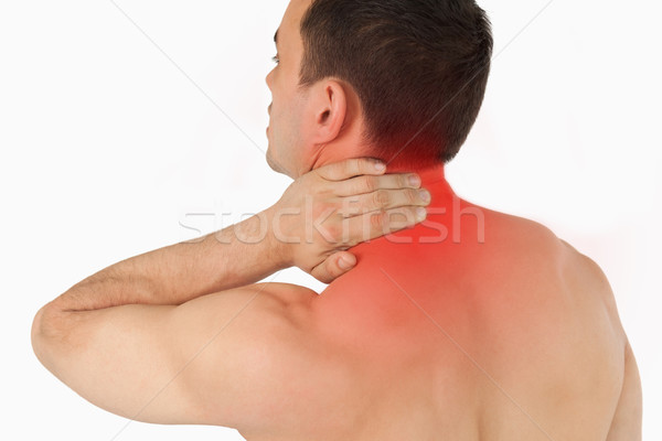 Young man experiencing neck pain Stock photo © wavebreak_media