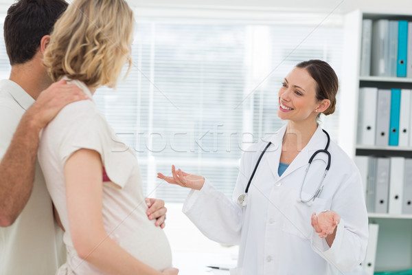 Orvos várandós pár boldog női klinika Stock fotó © wavebreak_media