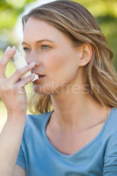 Woman using asthma inhaler in the park Stock photo © wavebreak_media