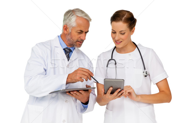 Stock photo: Male and female doctors with digital tablets