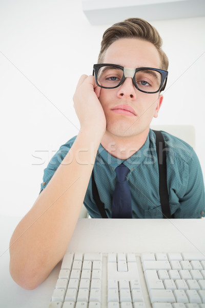 Casual bored businessman at his desk  Stock photo © wavebreak_media