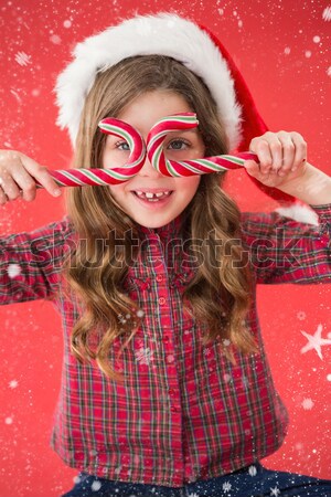 Festive redhead smiling at camera Stock photo © wavebreak_media