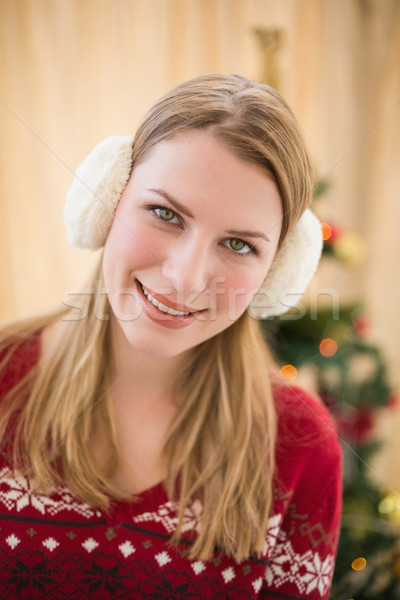 Portrait of a smiling blonde wearing earmuffs Stock photo © wavebreak_media