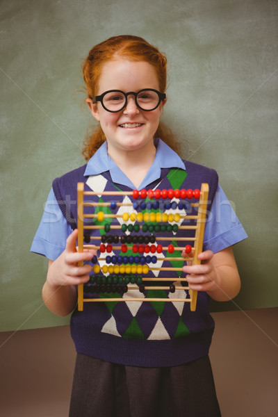 Portrait cute petite fille boulier tableau noir [[stock_photo]] © wavebreak_media