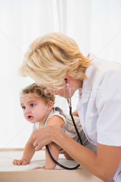 Blonde doctor with stethoscope and child  Stock photo © wavebreak_media