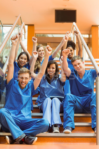 Stock photo: Medical students cheering on the steps