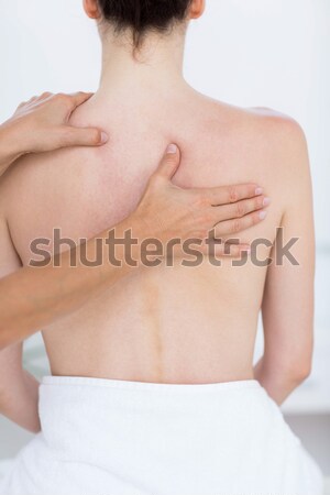 Brünette anfassen schmerzhaft zurück weiß Frau Stock foto © wavebreak_media
